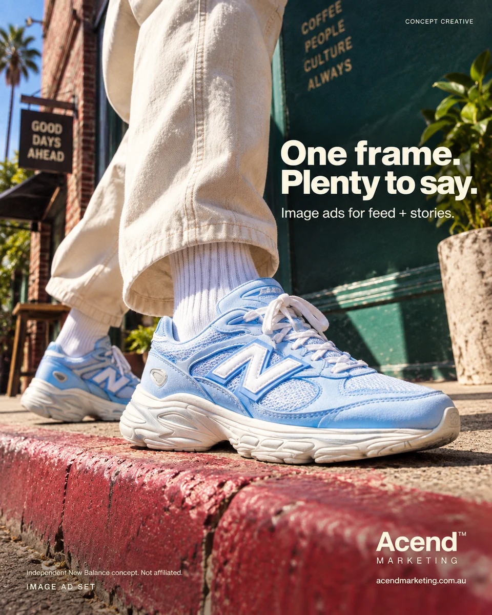 Low-angle concept photograph of blue-and-white New Balance sneakers, plain white socks and cream trousers on a raspberry curb beside a dark green shop wall. Acend Image Ad Set: “One frame. Plenty to say.” Independent New Balance concept, not affiliated.